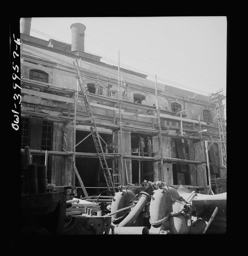 Catania, Sicily. Rebuilding the city. Wages comparable with peacetime are being paid by the Allied government. This money is charged against the Italian government, and will be paid later