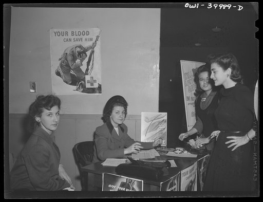 Untitled photo, possibly related to: Washington, D.C. The registration desk during a drive for blood donors sponsored by Local 203 of the United Federal Workers of America, Congress of Industrial Organizations (CIO), and the personnel division of the United States Office of War Information (OWI)
