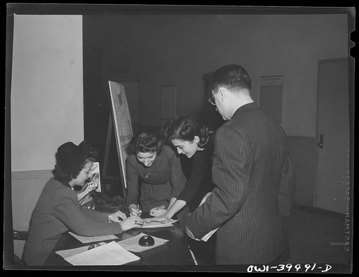 Untitled photo, possibly related to: Washington, D.C. The registration desk during a drive for blood donors sponsored by Local 203 of the United Federal Workers of America, Congress of Industrial Organizations (CIO), and the personnel division of the United States Office of War Information (OWI)
