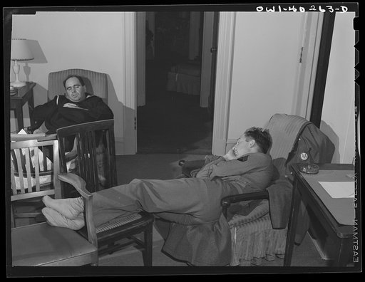 Washington, D.C. Servicemen who must wait several hours between trains sleeping in one of the lounges at the United Nations service center
