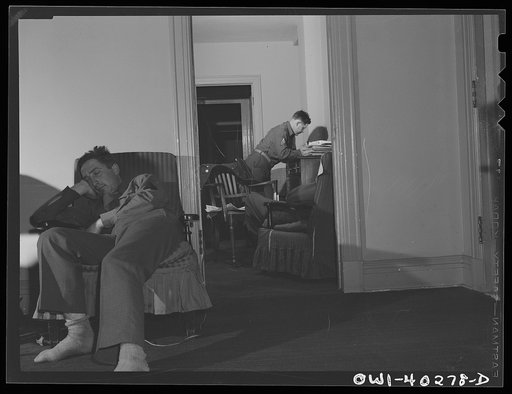 Washington, D.C. Servicemen who must wait several hours between trains sleeping in one of the lounges at the United Nations service center