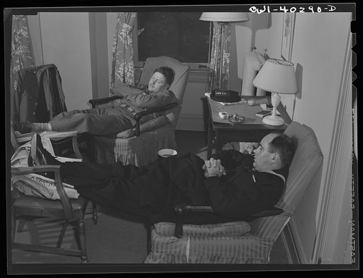 Washington, D.C. Servicemen who must wait several hours between trains sleeping in one of the lounges at the United Nations service center