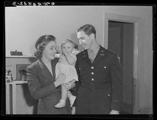 Washington, D.C. A young couple picking up their child who was taken care of in the nursery at the United Nations service center while they spent the day shopping