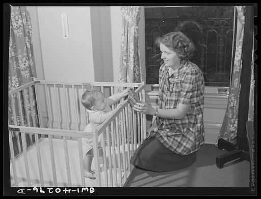 Washington, D.C. The child of a United States Army officer being cared for in the nursery at the United Nations service center while her parents spend the day shopping