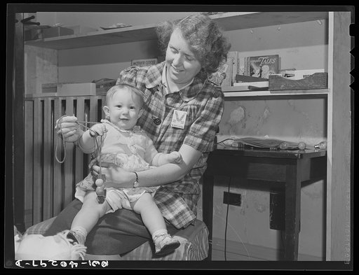 Washington, D.C. The child of a United States Army officer being cared for in the nursery at the United Nations service center while her parents spend the day shopping