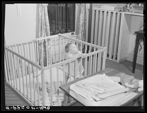 Untitled photo, possibly related to: Washington, D.C. The child of a United States Army officer being cared for in the nursery at the United Nations service center while her parents spend the day shopping
