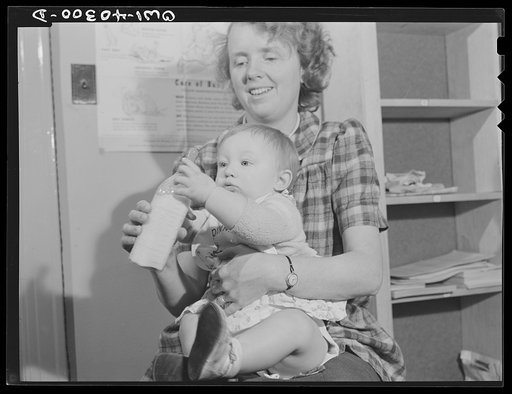 Washington, D.C. The child of a United States Army officer being cared for in the nursery at the United Nations service center while her parents spend the day shopping