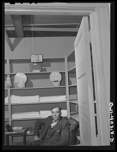 Washington, D.C. Attendant at the United Nations service center who furnishes soap, towels, and razors to boys who wish to clean up between trains or when they arrive in town