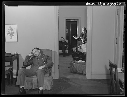 Washington, D.C. Servicemen who must wait several hours between trains sleeping in one of the lounges at the United Nations service center