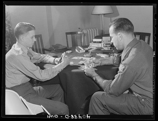 Washington, D.C. Soldiers waiting between trains enjoy a card game at the United Nations service center