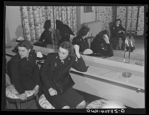 Washington, D.C. A group of WAVES (Women Accepted for Volunteer Emergency Service), just off a train, freshen up in the powder room at the United Nations service center