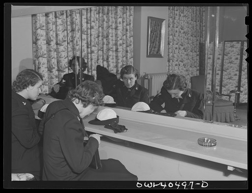 Washington, D.C. A group of WAVES (Women Accepted for Volunteer Emergency Service), just off a train, freshen up in the powder room at the United Nations service center