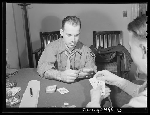 Washington, D.C. Soldiers waiting between trains enjoy a card game at the United Nations service center