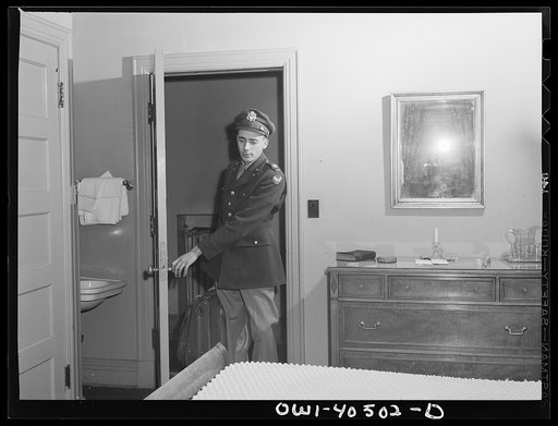 Washington, D.C. A lieutenant in the United States Army Air Transport Command entering his room at the United Nations service center