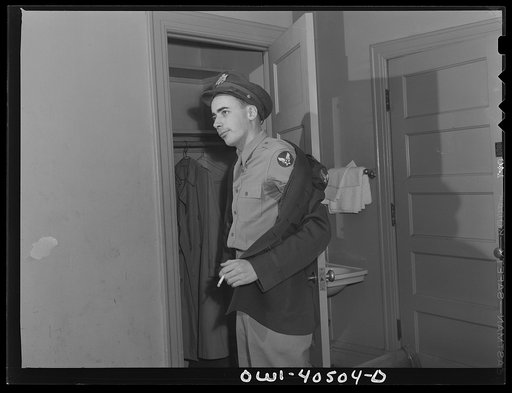 Washington, D.C. A lieutenant in the United States Army Air Transport Command in his room at the United Nations service center