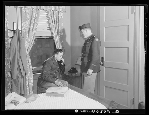 Washington, D.C. A lieutenant in the United States Army Air Transport Command calling the airport to check on flight conditions before checking out at the United Nations service center