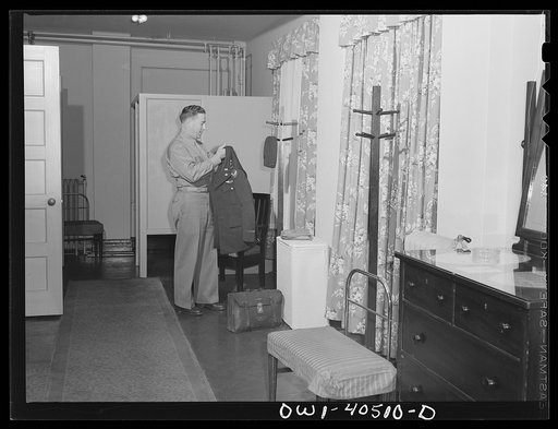 Washington, D.C. A lieutenant in the United States Army Air Transport Command in his room at the United Nations service center