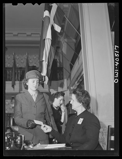 Washington, D.C. A girl Marine at the reception desk in the lobby of the United Nations service center