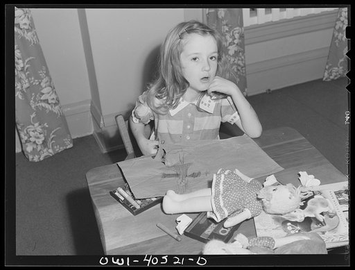 Washington, D.C. A child playing in the nursery at the United Nations service center while her mother is buying tickets at Union Station
