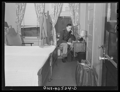 Washington, D.C. A lieutenant in the United States Army Air Transport Command calling the airport to check on flight conditions before checking out at the United Nations service center