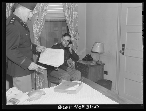 Washington, D.C. A lieutenant in the United States Army Air Transport Command calling the airport to check on flight conditions before checking out at the United Nations service center