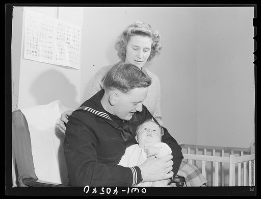 Untitled photo, possibly related to: Washington, D.C. Hugh and Lynn Massman with their son Joey in the nursery at the United Nations service center