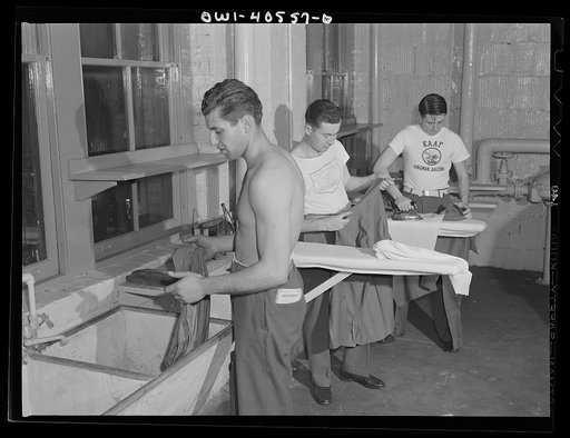 Washington, D.C. Servicemen using the laundry facilities in the sub-basement of the United Nations service center. It is not necessary to engage a hotel room in order to use these accomodations
