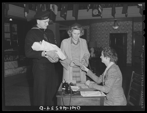 Washington, D.C. Hugh and Lynn Massman at the United Nations service center. Just arrived in Washington, they are told they can leave their baby in the nursery while they see the town and find a place to live