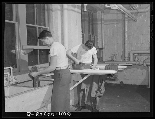 Untitled photo, possibly related to: Washington, D.C. Servicemen using the laundry facilities in the sub-basement of the United Nations service center. It is not necessary to engage a hotel room in order to use these accomodations