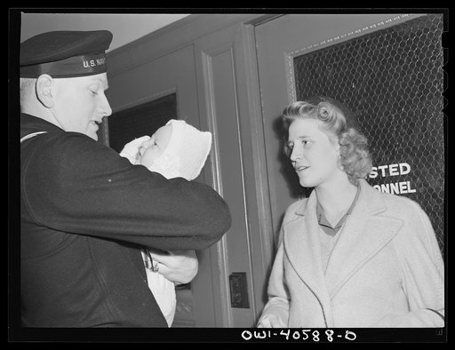 Washington, D.C. Hugh and Lynn Massman, with their son Joey, leaving the United Nations service center