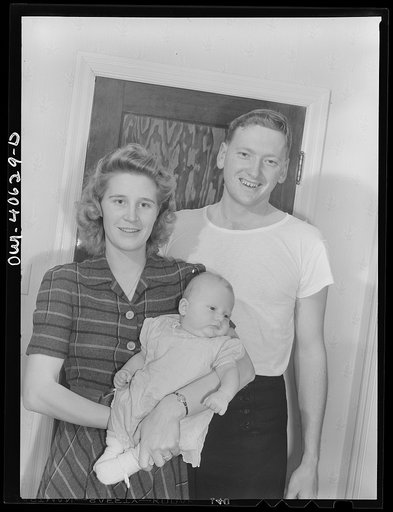 Washington, D.C. Hugh Massman, a student at the Naval Air Station, with his wife, Lynn and eight weeks old son, Joey
