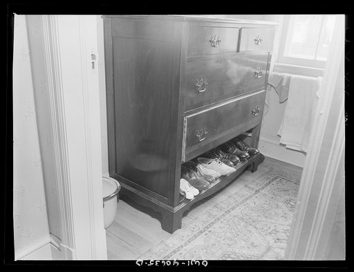 Washington, D.C. Bureau and shoes in the room of Hugh Massman, a second class petty officer who is studying in Washington, and his wife