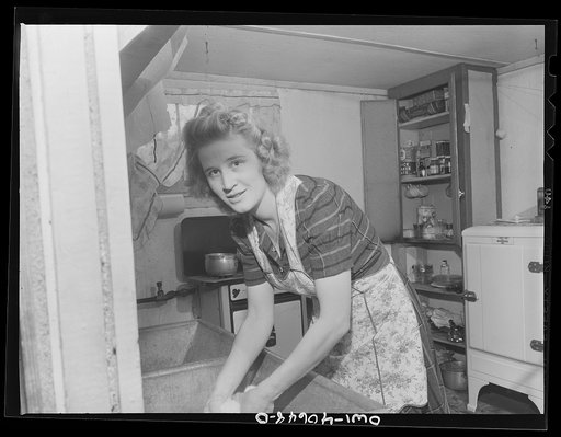 Untitled photo, possibly related to: Washington, D.C. Lynn Massman, wife of a second class petty officer who is  studying in Washington, does the washing every morning