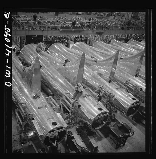 Untitled photo, possibly related to: Boeing aircraft plant, Seattle, Washington. Production of B-17F (Flying Fortress) bombing planes. Tail section of B-17F (Flying Fortress) bombers