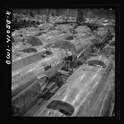 Untitled photo, possibly related to: Boeing aircraft plant, Seattle, Washington. Production of B-17F (Flying Fortress) bombing planes. Fuselage sections