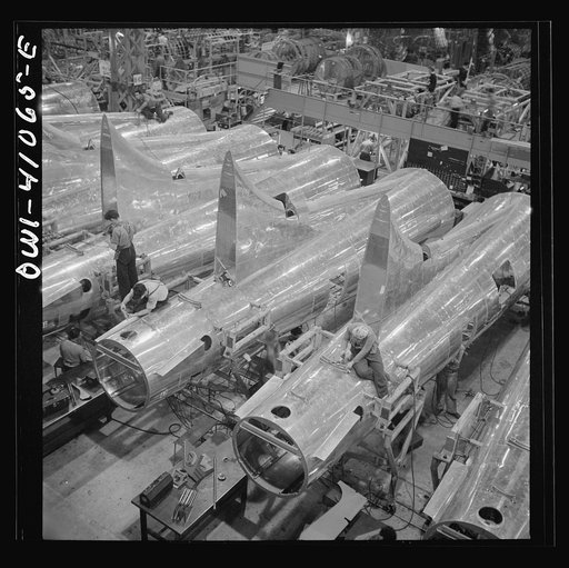 Untitled photo, possibly related to: Boeing aircraft plant, Seattle, Washington. Production of B-17F (Flying Fortress) bombing planes. Tail section of B-17F (Flying Fortress) bombers
