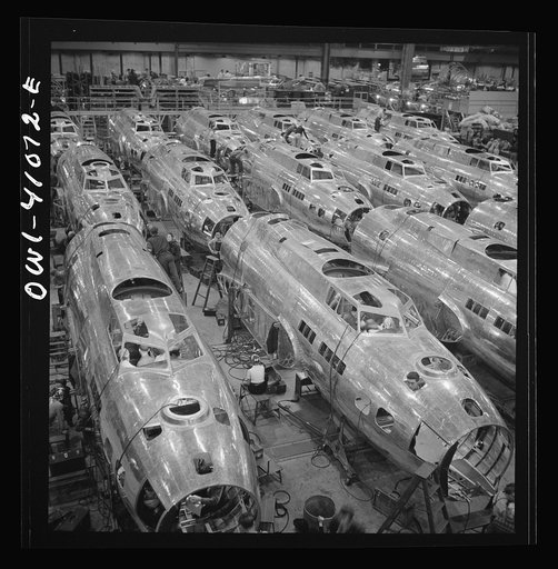 Untitled photo, possibly related to: Boeing aircraft plant, Seattle, Washington. Production of B-17F (Flying Fortress) bombing planes. Fuselage sections