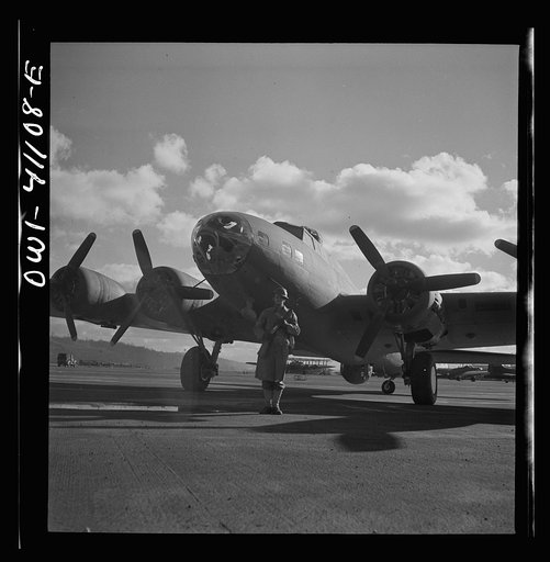 Untitled photo, possibly related to: Production. B-17 heavy bomber. An Army sentry guards new B-17F (Flying Fortress) bombers at the airfield of Boeing's Seattle plant. The ship will be delivered to the Army and the Navy after they have successfully undergone flight tests. The Flying Fortress has pe