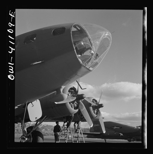 Boeing aircraft plant, Seattle, Washington. Production of B-17F(Flying Fortress) bombing planes. Lubricating and servicing a new B-17F (Flying Fortress) bombers