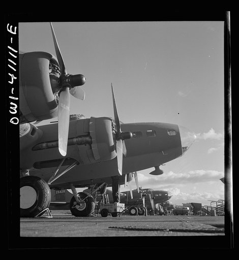Untitled photo, possibly related to: Boeing aircraft plant, Seattle, Washington. Production of B-17F (Flying Fortress) bombing planes. Lubricating and servicing a new B-17F (Flying Fortress) bombers