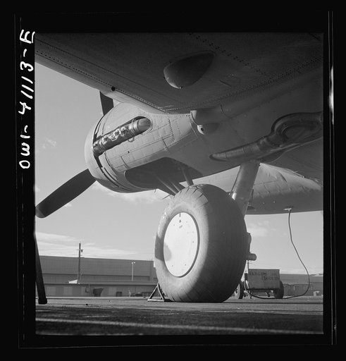 Untitled photo, possibly related to: Boeing aircraft plant, Seattle, Washington. Production of B-17F (Flying Fortress) bombing planes. Lubricating and servicing a new B-17F (Flying Fortress) bombers