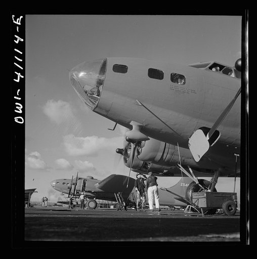 Boeing aircraft plant, Seattle, Washington. Production of B-17F (Flying Fortress) bombing planes. Lubricating and servicing a new B-17F (Flying Fortress) bomber