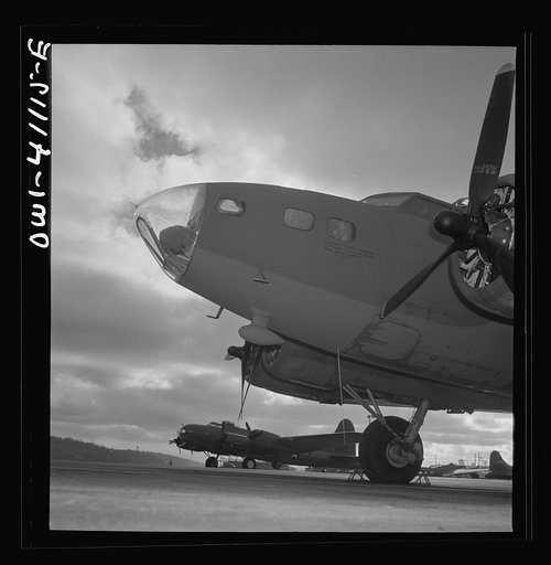 Untitled photo, possibly related to: Boeing aircraft plant, Seattle, Washington. Production of B-17F(Flying Fortress) bombing planes. Lubricating and servicing a new B-17F (Flying Fortress) bombers