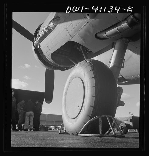 Untitled photo, possibly related to: Boeing aircraft plant, Seattle, Washington. Production of B-17F (Flying Fortress) bombing planes. Lubricating and servicing a new B-17F (Flying Fortress) bombers.