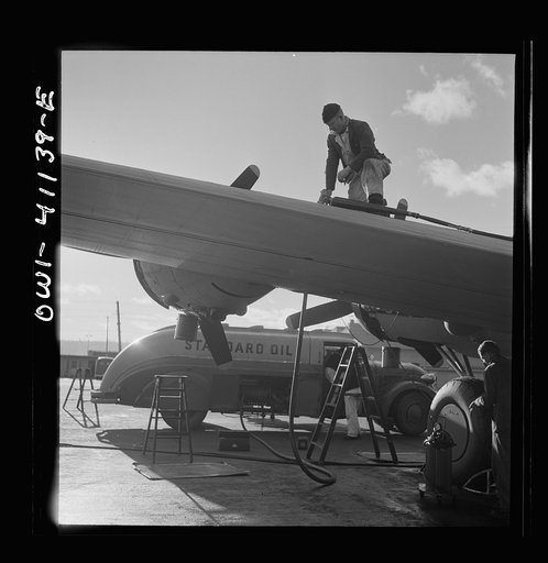 Untitled photo, possibly related to: Boeing aircraft plant, Seattle, Washington. Production of B-17F (Flying Fortress) bombing planes. Fueling a B-17F (Flying Fortress) bombers.