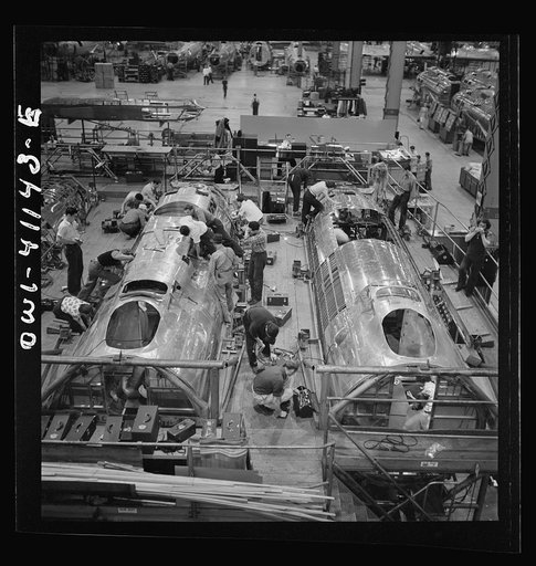 Untitled photo, possibly related to: Boeing aircraft plant, Seattle, Washington. Production of B-17F (Flying Fortress) bombing planes. Fuselage sections.