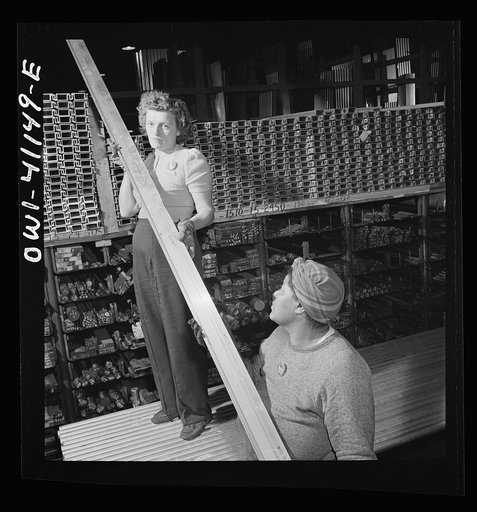 Boeing aircraft plant, Seattle, Washington. Production of B-17F (Flying Fortress) bombing planes. Warehouse handing out material for the building of B-17F (Flying Fortress) bombers