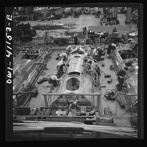 Untitled photo, possibly related to: Boeing aircraft plant, Seattle, Washington. Production of B-17F (Flying Fortress) bombing planes. Fuselage sections.