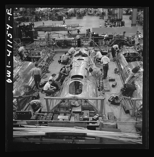 Untitled photo, possibly related to: Boeing aircraft plant, Seattle, Washington. Production of B-17F (Flying Fortress) bombing planes. Fuselage sections.