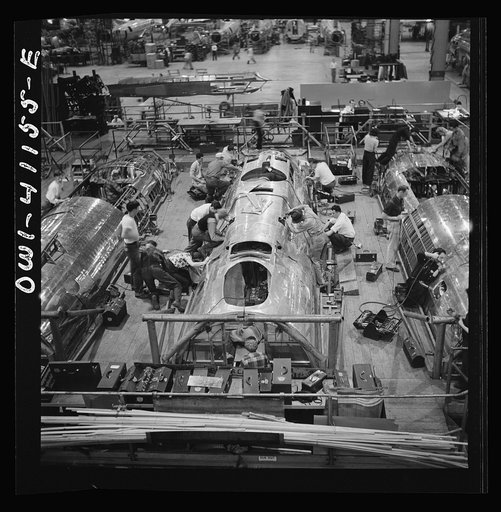 Untitled photo, possibly related to: Boeing aircraft plant, Seattle, Washington. Production of B-17F (Flying Fortress) bombing planes. Fuselage sections.